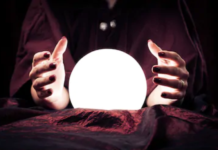 How to Tell if a Fortune Teller is Accurate Hands surrounding a glowing orb