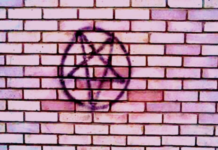 Witchcraft Activism, by David Salisbury Pentagram painted on a brick wall, photo by Thomas Lee-Smith