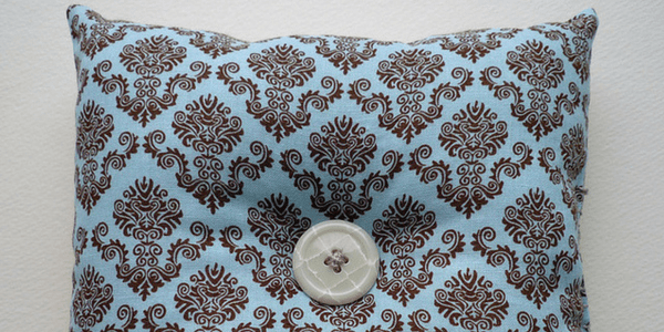Blue pillow with button, photo by Nancy L. Stockdale
