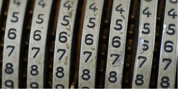 Numbers on a mechanical calculator, photo by e y e s e e