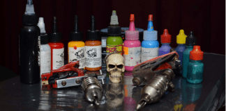 Tattoo magick: Body art for magicians Tattoo machine, ink, and small skull, photo by diegoservelion