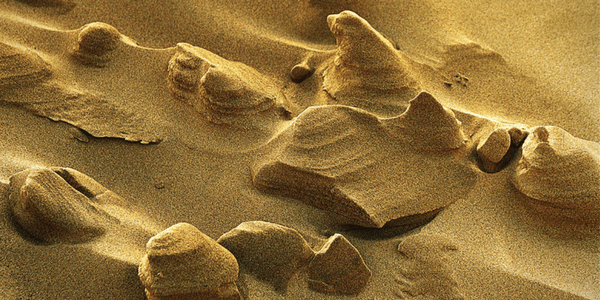 Wind worked sand, photo by Vincent Brassinne