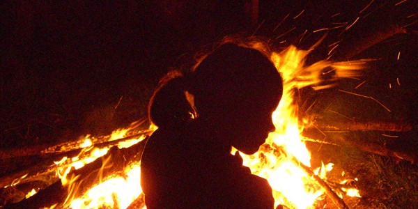 Sharing your magick with children: Feeding their curiosity and facing your challenges Child, campfire, photo by Rudi Schlatte