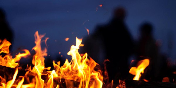 Yule: Lighting up the night Yule log, photo by Brian Colson
